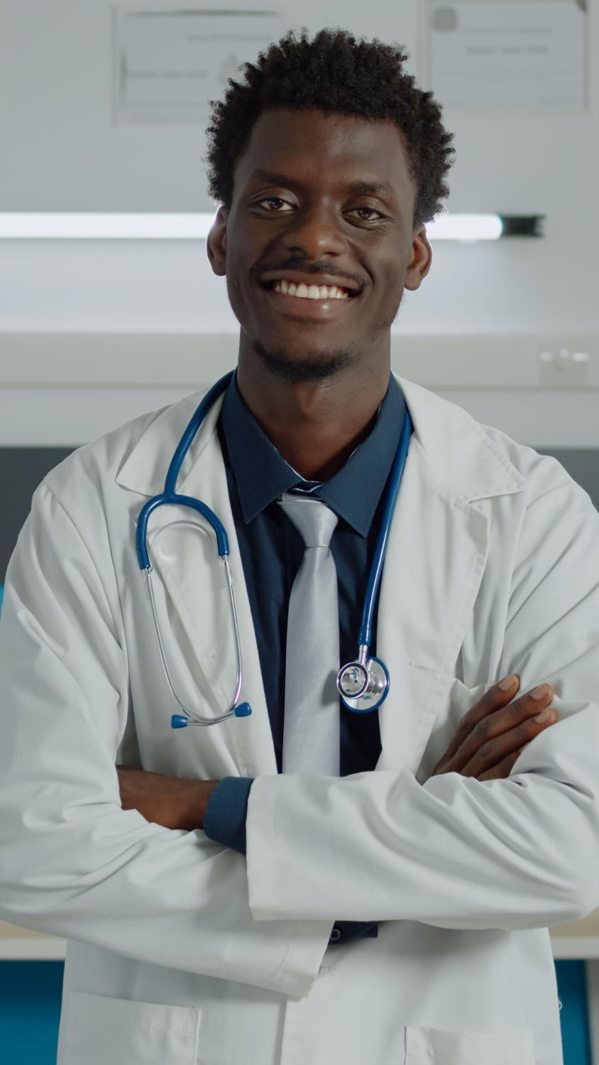 portrait-african-american-doctor-looking-camera-wearing-white-coat-stethoscope-consultation-black-man-smiling-doctors-office-with-equipment-healthcare-facility
